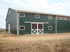 horse barn and arena by Stable Hollow Construction.