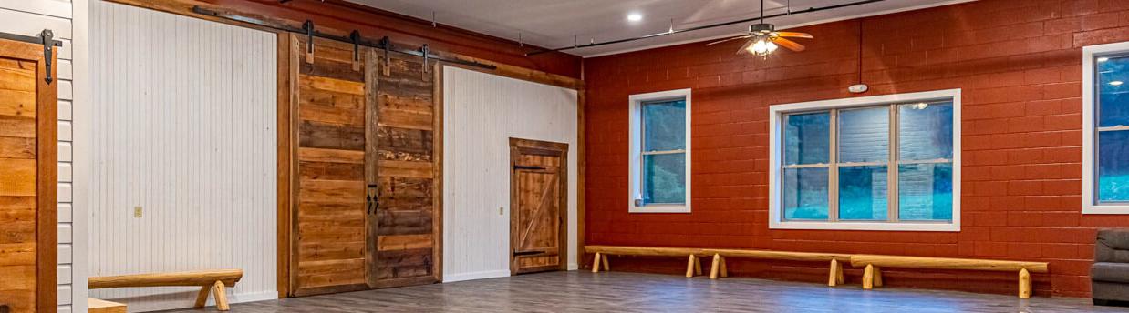 refinished barn with sliding doors made with reclaimed wood