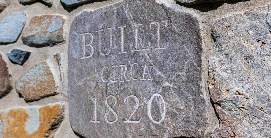 Stone memorializing the history of the barn.