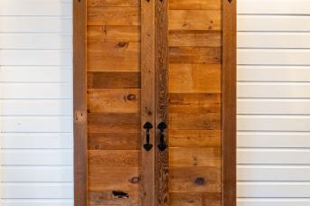 Interior barn style doors made from reclaimed lumber