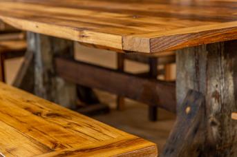 Detail shot of table built from repurposed barn wood.
