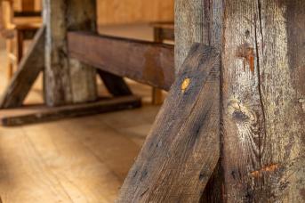 Detail shot of table built from repurposed barn wood.