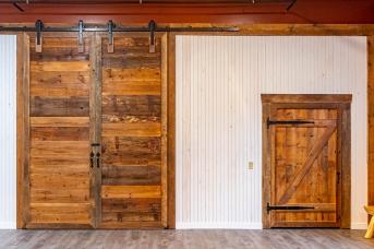 Beams and doors from salvaged barn lumber
