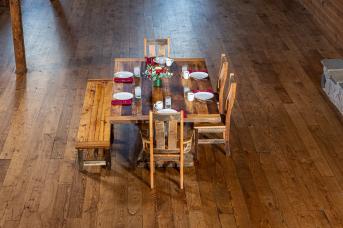 Over head shot of a dining table with chairs and bench made with reclaimed wood