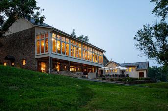 Outside view of the restored Macungie barn at dusk