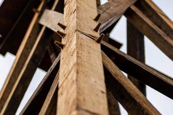 Pinned barn beams used for legs of windmill