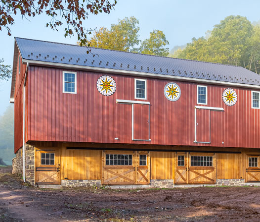 red barn with quilt pattern on the front