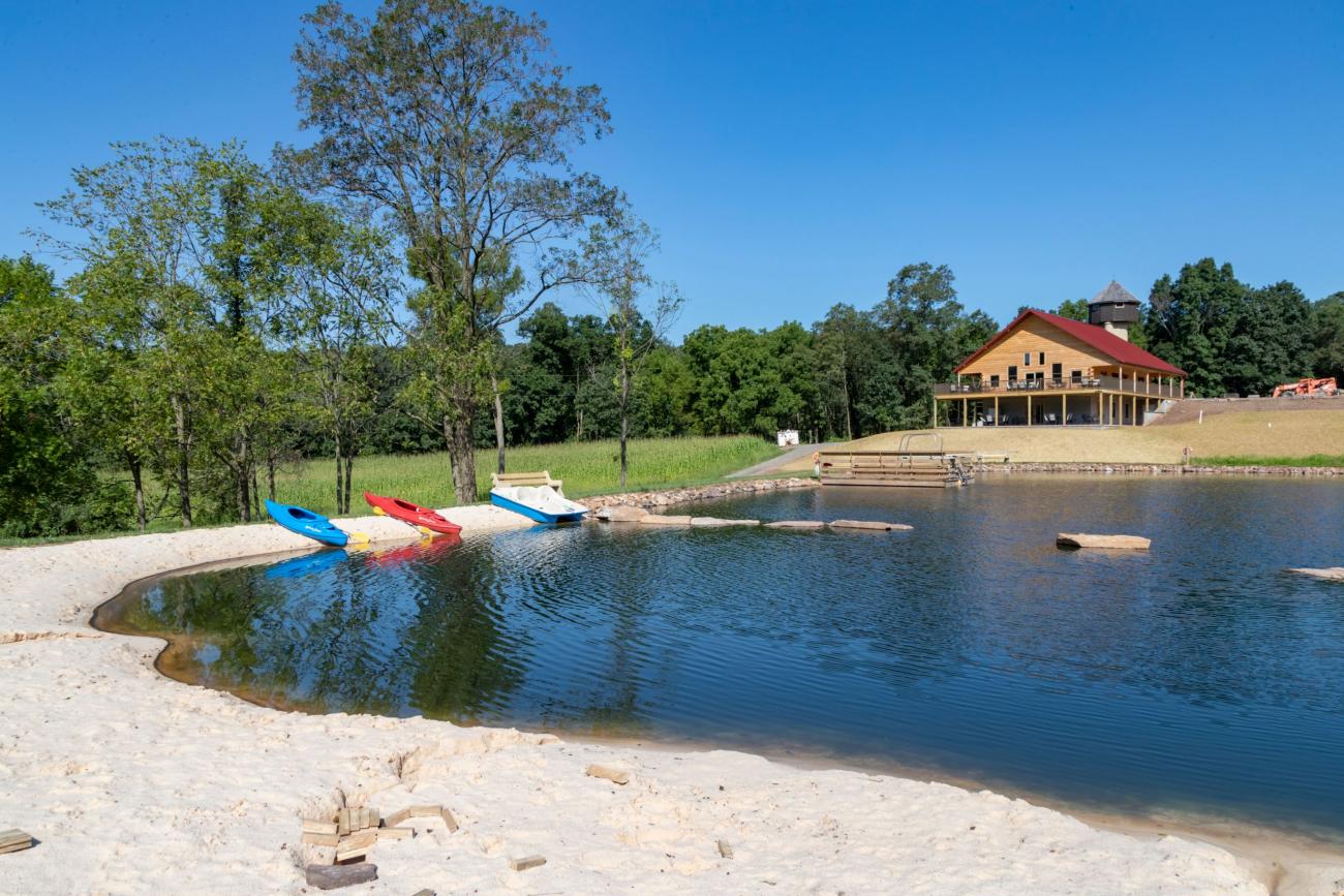 View of pond beach and boat dock