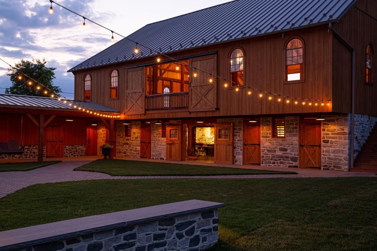 wedding barn at dusk with outdoor lighting