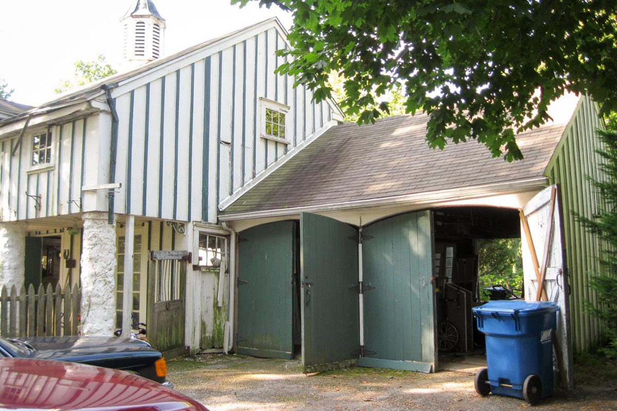 Before: The barn and poolhouse before restoration