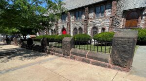 Stone Wall in front of Stone Church