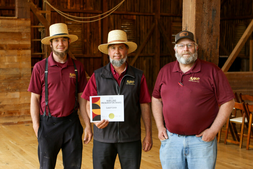Stable Hollow Construction team receiving the 2024 Maryland Preservation Award for the Claggett Center barn restoration.